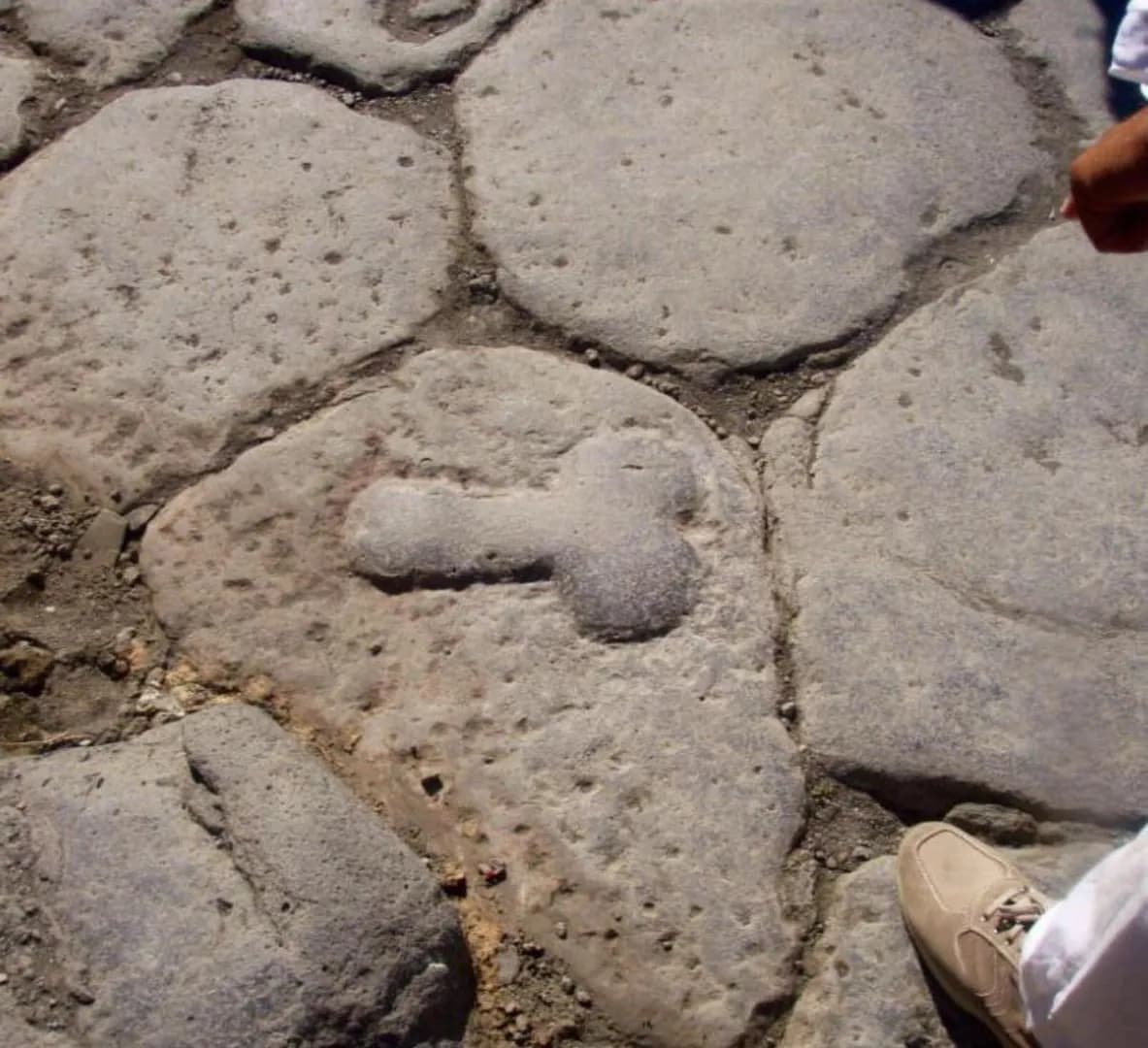 In Pompeii, phallic symbols on local roadways pointed the way to the nearest brothel; possibly to direct foreign sailors who didn't speak Latin