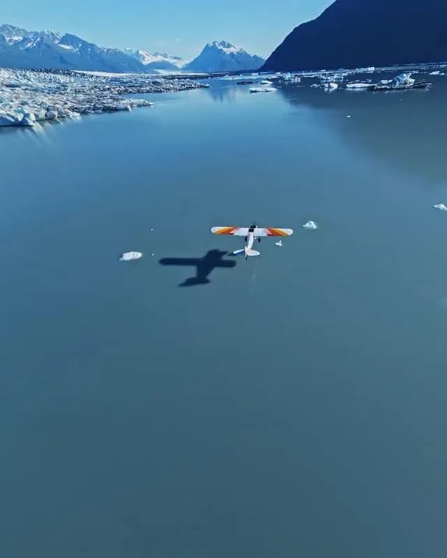 Pilot water skiing in a glacier