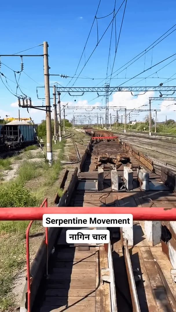 The oddly satisfying way these long welded steel rails flex and slither like a giant snake behind the train