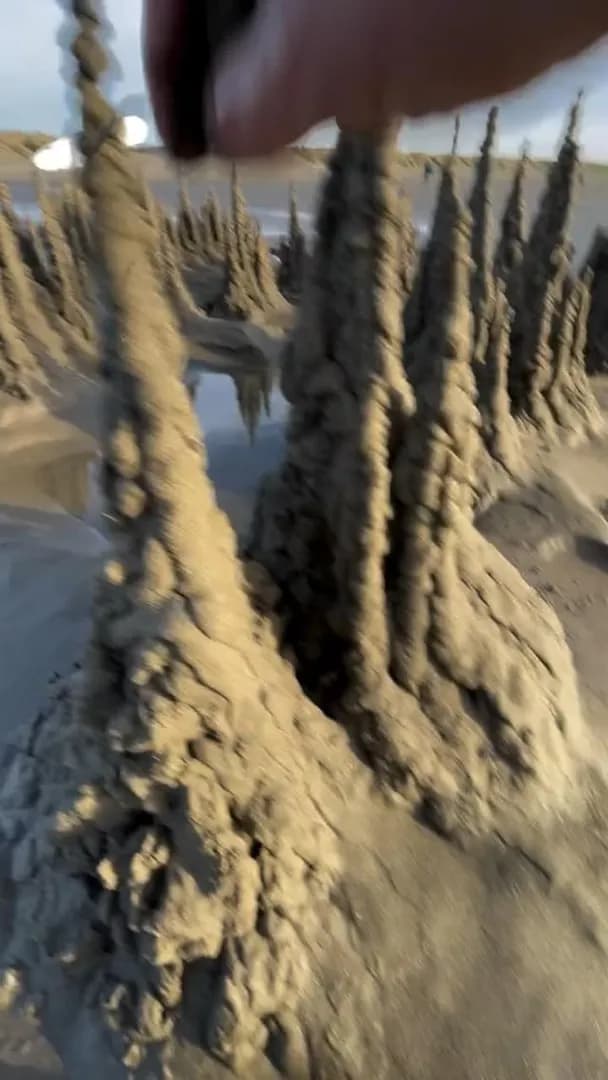 Sand sculpting a “witch castle”