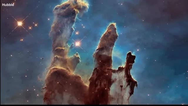 The Pillars of Creation, as photographed by the Hubble and Webb telescopes.