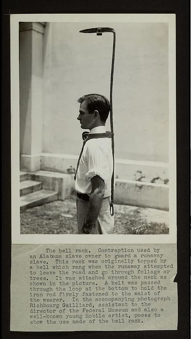 "Bell rack" modeled by museum worker. A device made to stop runaway slaves in Mobile, Alabama, Photo circa 1937.