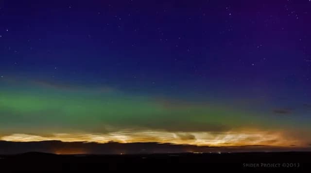 A stunning timelapse capturing rare Noctilucent Clouds and the Aurora Borealis moving together over Scotland.