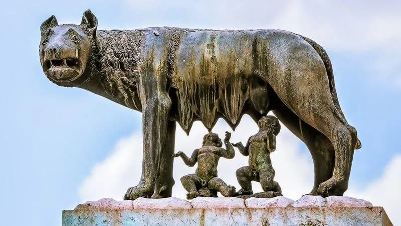 In Roman mythology, Romulus and Remus were twin brothers abandoned as infants near the Tiber River. A sacred she-wolf (lupa) found and nursed them in her cave, saving them from death before a shepherd