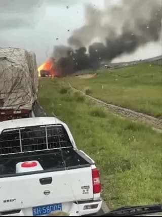 A fuel truck in China exploding, leaving a 15ft crater Truck was carrying ammonium nitrate