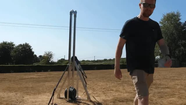 Youtuber Tom Stanton has created a fully mechanical trebuchet that fires at supersonic speed