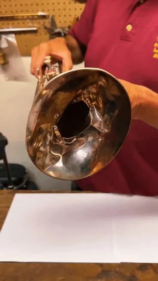 Repairing dented trumpet bell