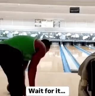 Guy bowls two strikes at the same time