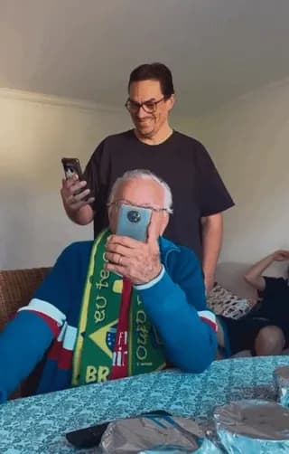 Son who lives abroad returns home and video calls his father