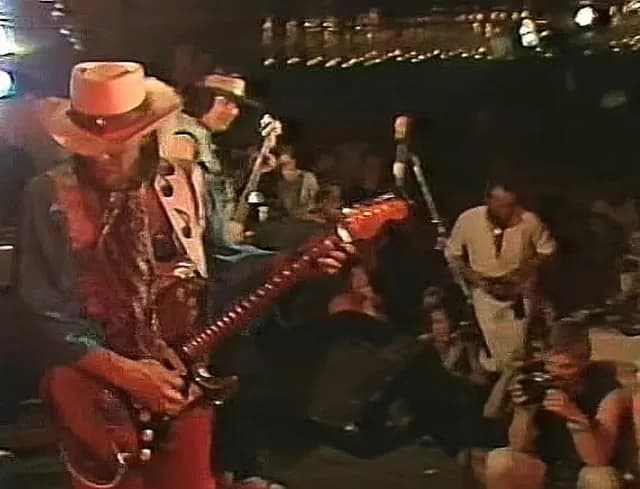 Stevie Ray Vaughan Playing a Solo With His Teeth and Shaking Hands With a Fan (1985)