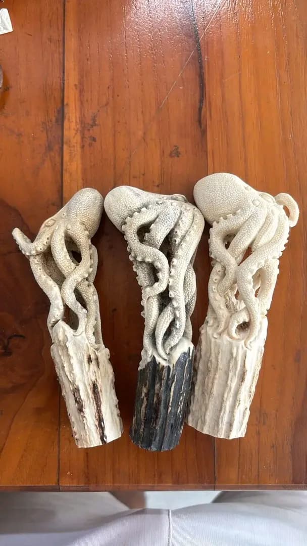 I made an octopus shaped handle carving from carved deer antler material.