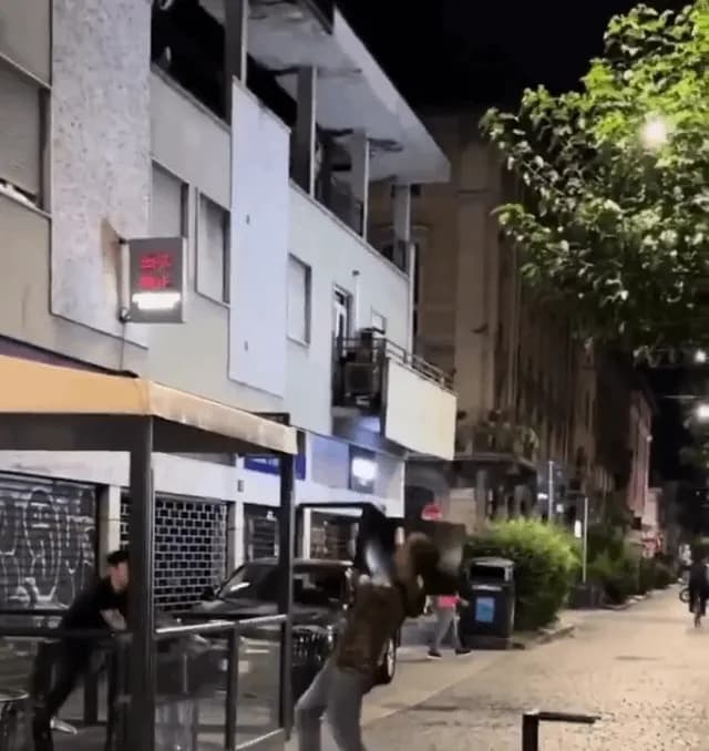 Barman goes full action hero mode to disarm a guy with a knife using patio furniture.