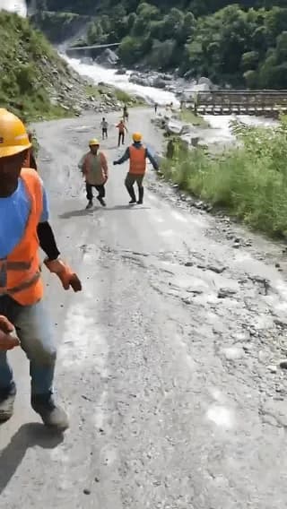 Ground level footage shows people running for their lives as a sudden flash flood tears through the Nepal-Tibet region
