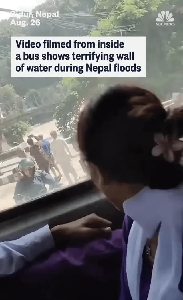 Kids scream on the bus as they watch water burst through a dam in Nepal.