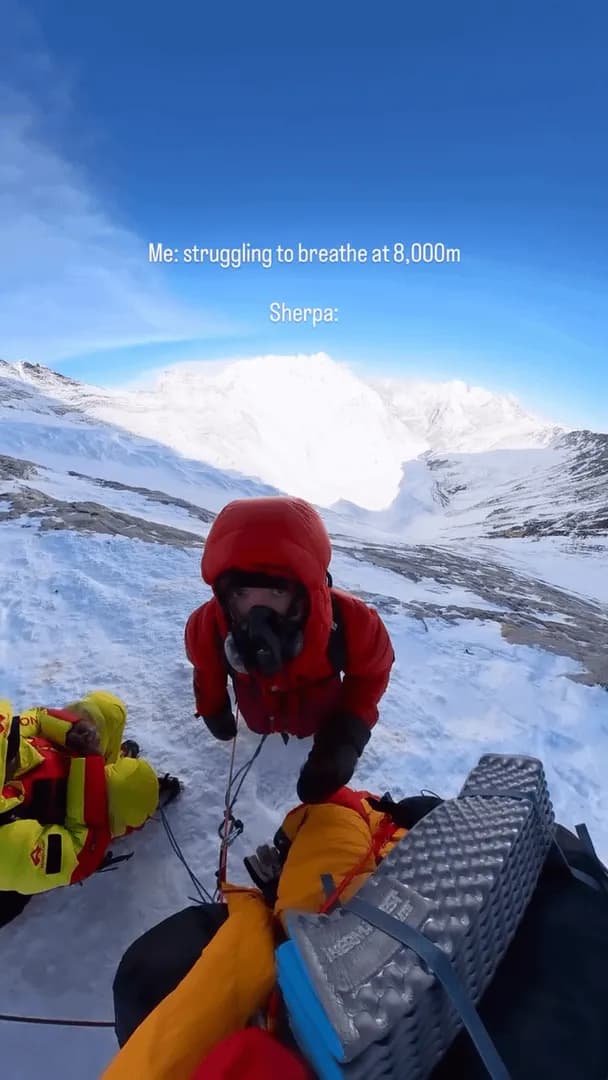 [OC] A Sherpa casually smoking above 8,000 meters on Everest while everyone around him struggles to breathe