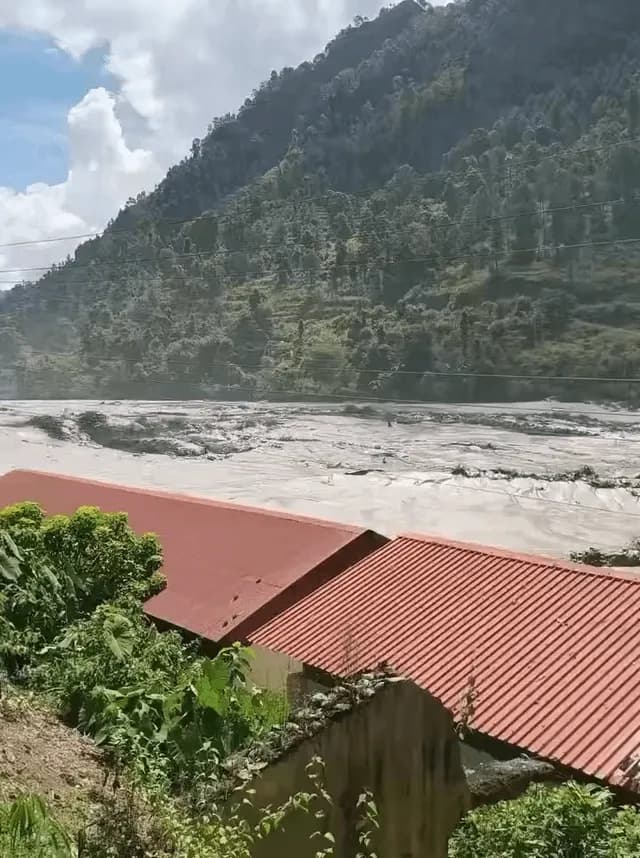 Terrifying footage of the Nepal floods shows floodwater moving a giant boulder like a toy.
