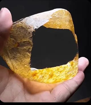 A naturally formed golden crystal with remarkable optical clarity