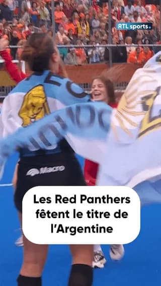 Belgium players join the celebrations after Argentina wins the FIH Hockey women's World Cup by beating the Netherlands