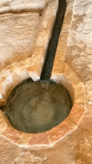 Satisfying flow of an ancient water spring system inside a rock cave