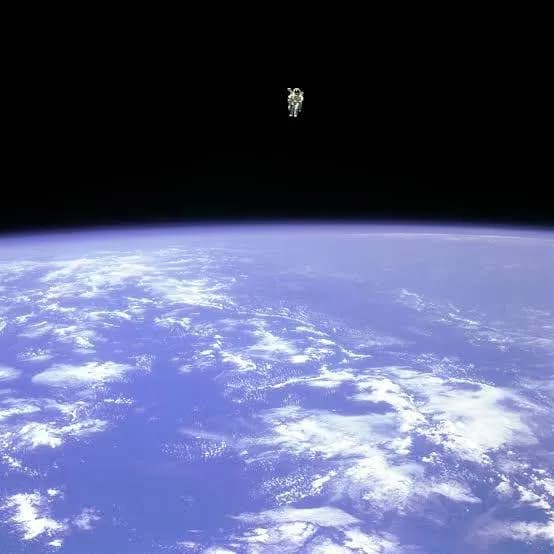 Bruce McCandless II Floating in space testing a nitrogen-powered jetpack in 1984.