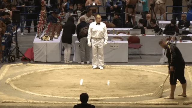 A youth sumo match where a much smaller wrestler overcomes a massive size disadvantage