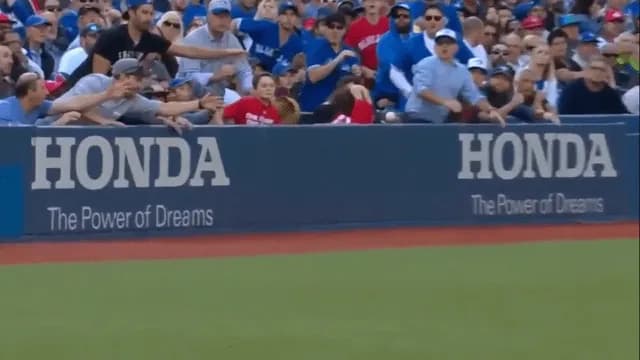 While the adults brace themselves, a kid shows off his quick reflex and glovework