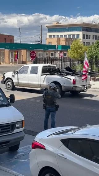 A Guy Just Rolled up to the Sheriff with a Pickup stacked like a scrapyard of Flock Cameras and an American Flag Hanging off the Back.