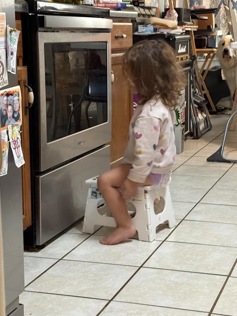 My 2 year old waiting on the frozen pizzas