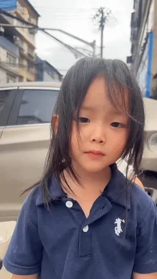 A kid staring at the camera