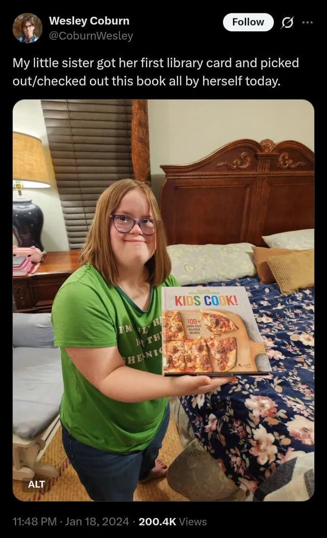 This young lady got her library card and checked out a book all by herself