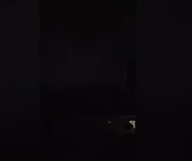 A massive nighttime tornado in Wheatfield, Indiana, revealed only by intense backlighting from a severe thunderstorm.