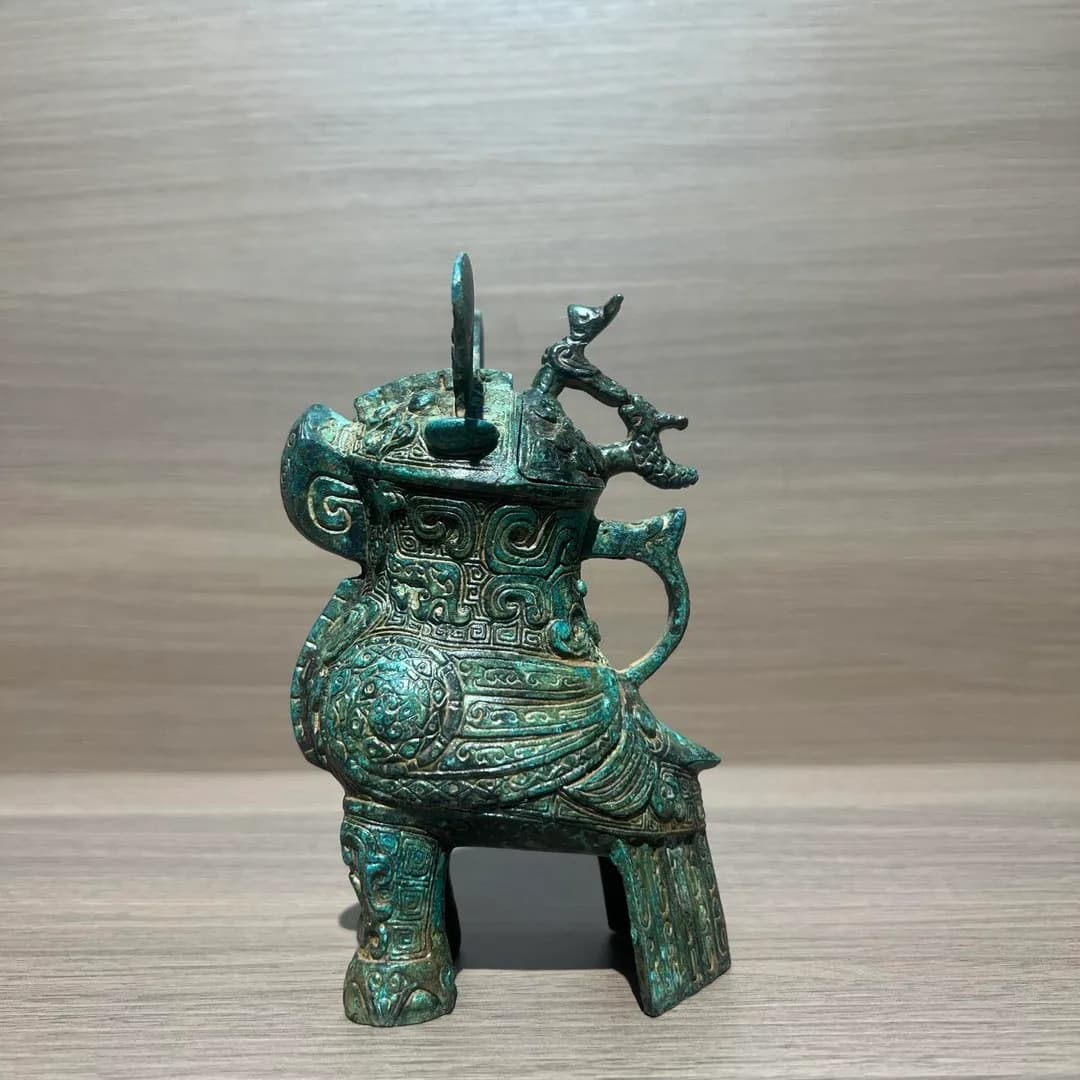A ceremonial wine vessel crafted in the shape of an owl(Fu Hao Owl Zun ), dating back 3000 years, Shang Dynasty. The image shows a replica, the original artifact is kept at Henan Museum.
