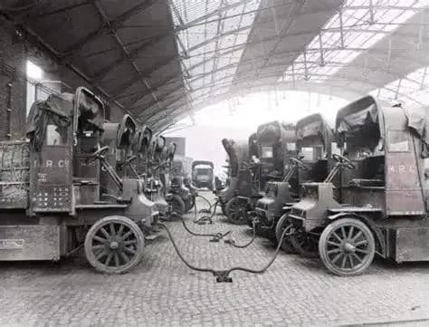 Electric trucks being charget at station St Pancras goods depot, London, England. 11 of July 1917.