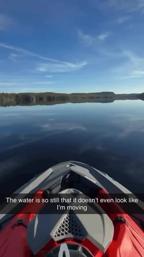 The water is so still that it looks like he's not even moving