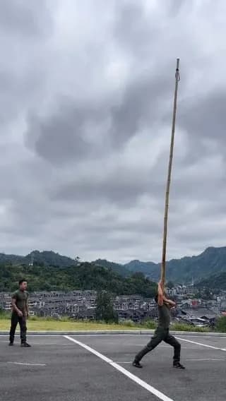 Kong Lingwei is a recognized representative inheritor of Konglou Acrobatics, a traditional Chinese bamboo-pole routine and intangible cultural heritage with over 400 years of history