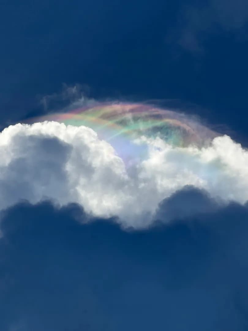 My dad took these photos of a crazy-looking repeating rainbow in the clouds over Palm Coast, FL.