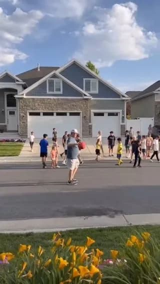 His father organizes games and activities with the neighborhood children so that his son with Down syndrome can play and make friends