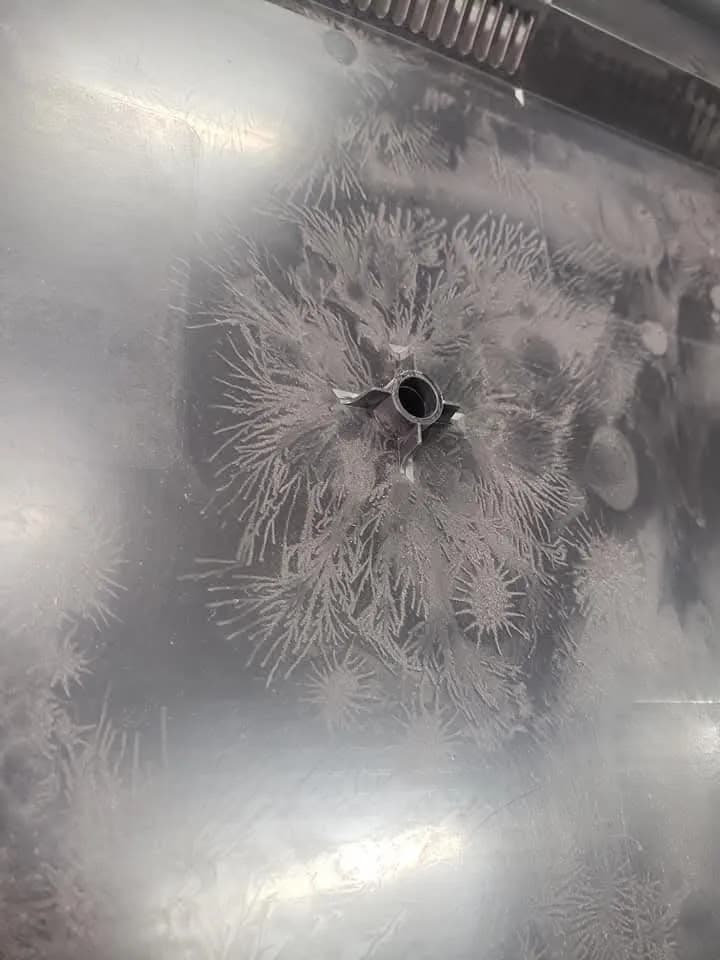 A peek inside of the back panel of a flat screen tv