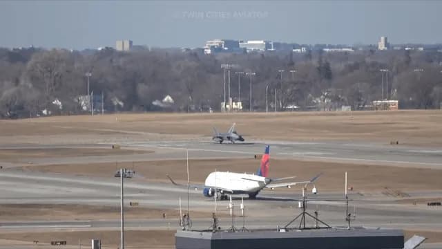 F-22 Raptor retracts the gear just milliseconds after lifting off the runway.