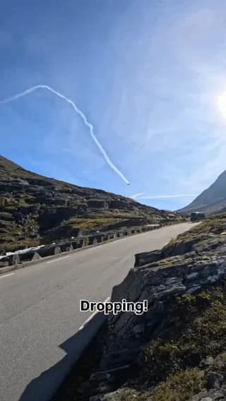 This wingsuit flight above a 10% descent road.
