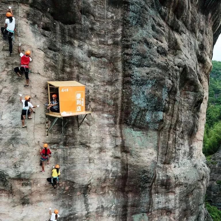 This shop is dubbed the most inconvenient convenience store. Hangs 393 feet (120m) on a vertical cliff at Hunan, China, selling water bottles without any price markup