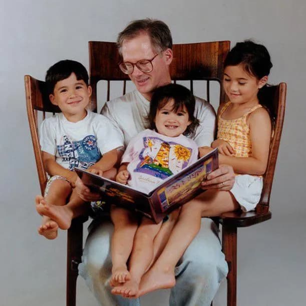 In 1995, Hal Taylor built this special rocking chair after his third child was born, so he could sit with all three of his children and read books together.