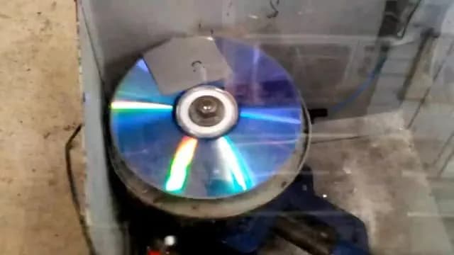 Exploding a CD at very high speed