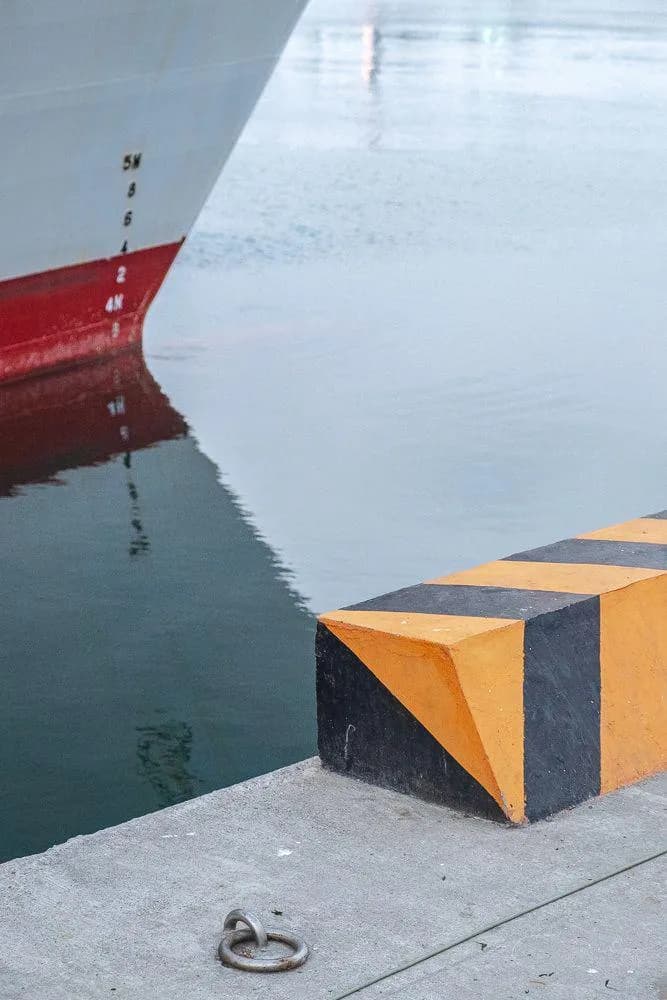 The reflection of the boat lines up perfectly.