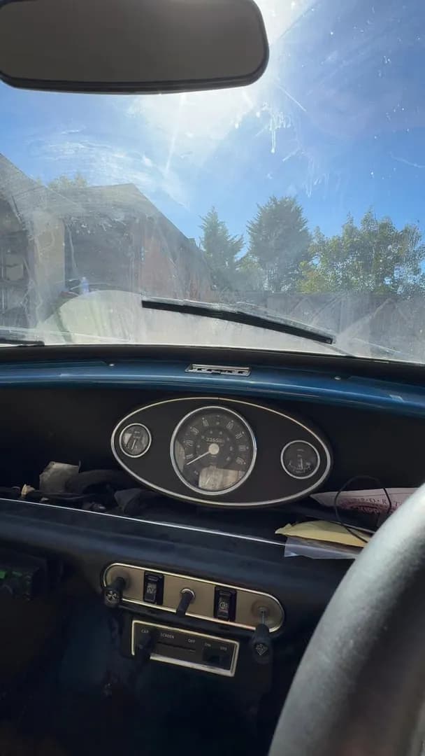 Manual, hand pumped screen wash, in a 1970s Mini.