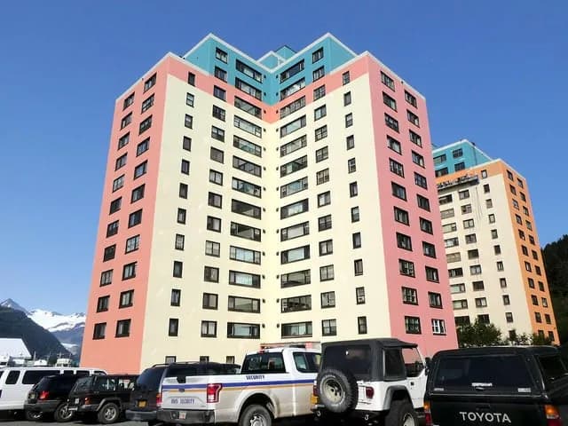 TIL that in Whittier, Alaska, nearly all of its roughly 270 residents live in a single 14-story building, "Begich Towers", which also houses the post office, grocery store, school, and church. The tow