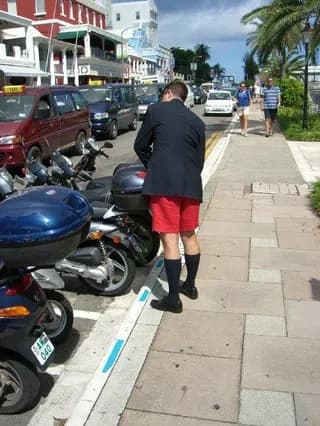 TIL Bermuda shorts are considered appropriate business attire for men in Bermuda, when made of suit-like material and worn with knee-length socks, a dress shirt, tie, and blazer