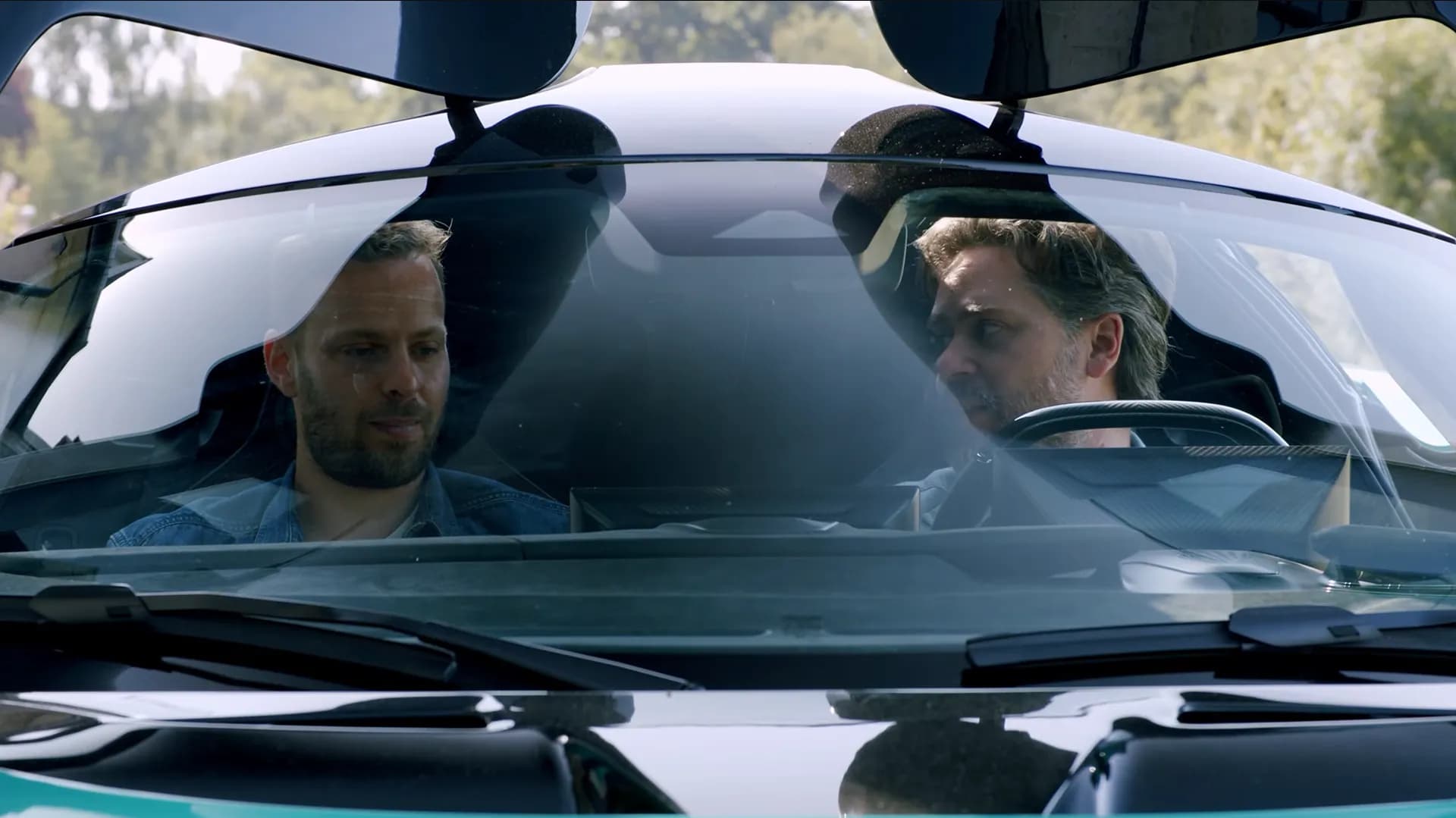 The Aston Martin Valhalla, a $800,000 hyper car, casts dick shadows on the passenger and driver when the doors are open.