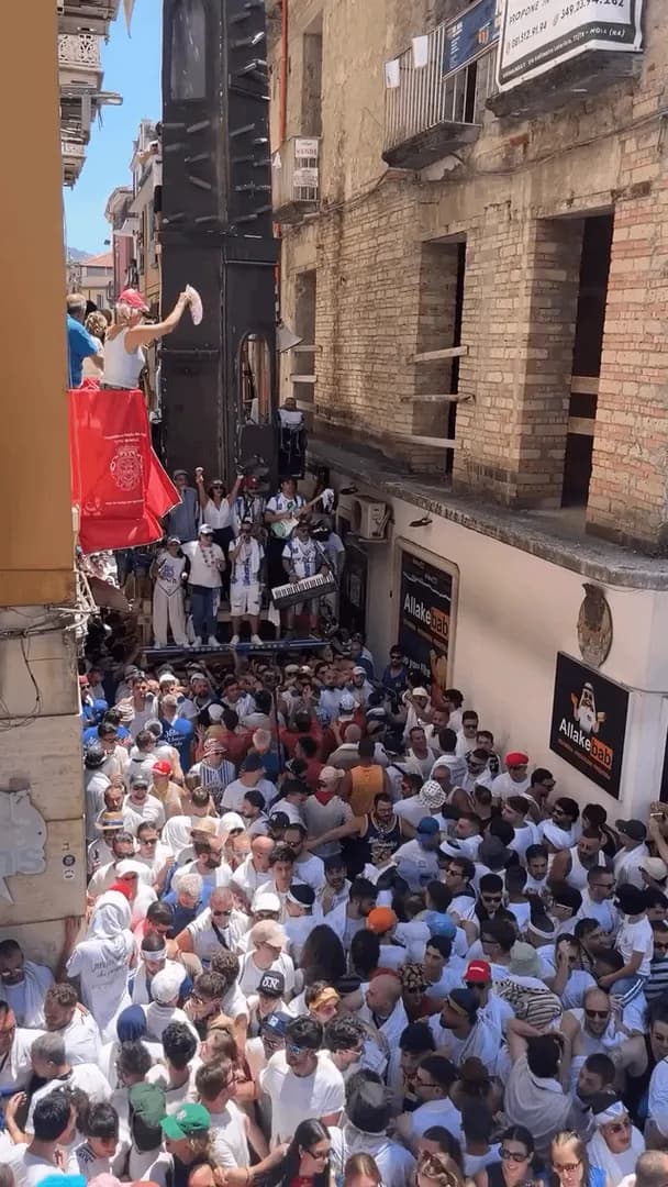 In Nola, Italy, over 100 men carry a 25-meter-tall, 2.5-ton (5,500-lb) tower through packed narrow streets, a centuries-old tradition honoring Saint Paulinus