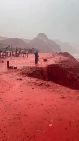 When torrential rains hit Hormuz Island, its iron-rich soil is swept into the sea, staining the shoreline a striking shade of red.